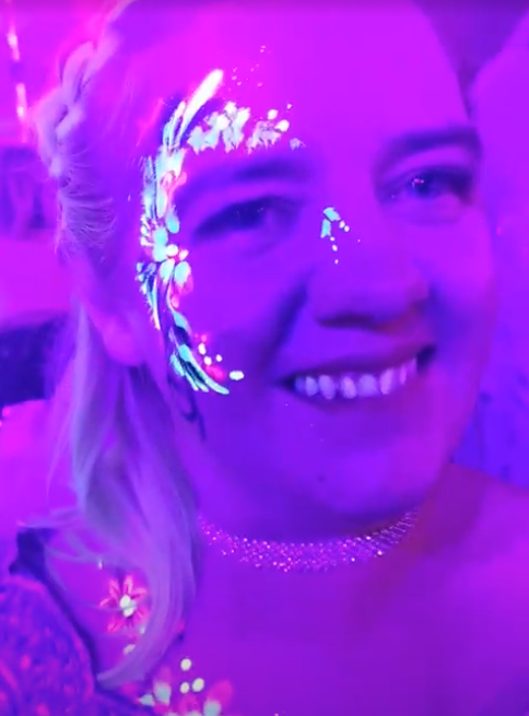 UV facepaint on lady at a corporate party